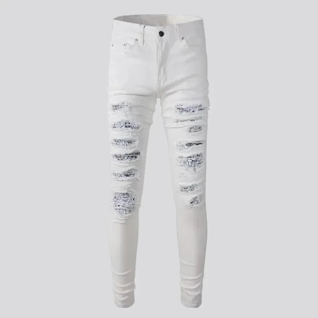 Distressed painted-patches jeans for men